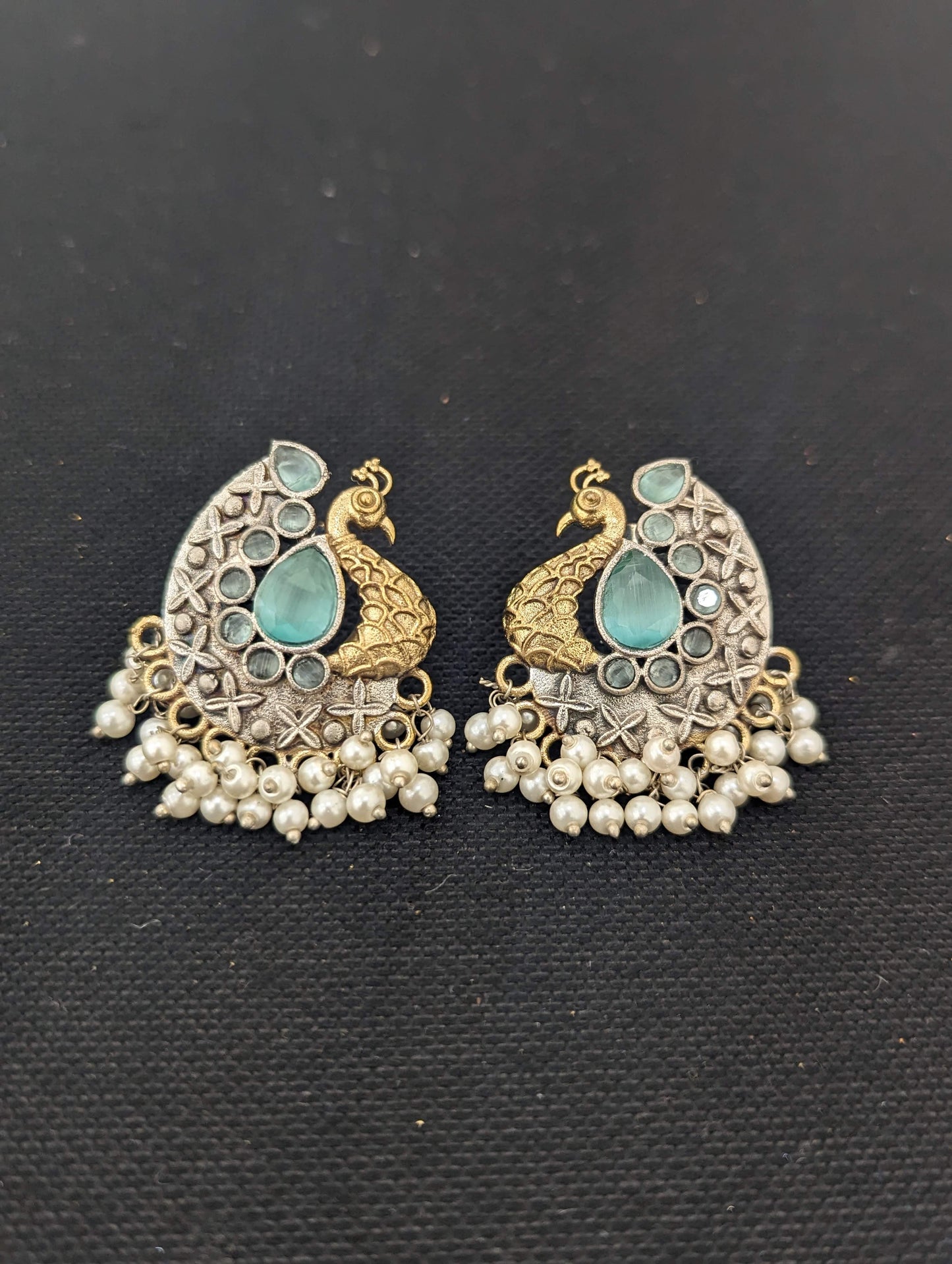 Peacock Dual tone german silver stud earrings