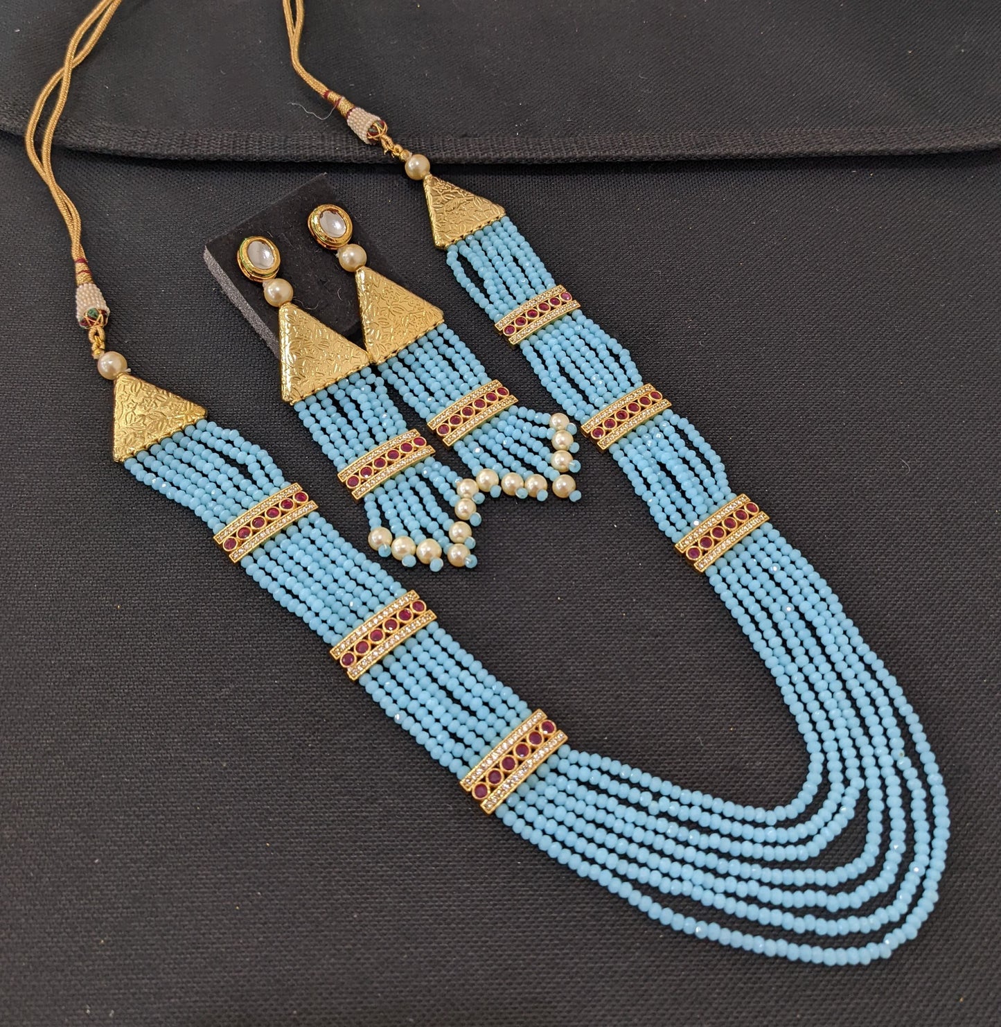 Multi stranded light blue crystal bead long chain necklace and tassel earrings set