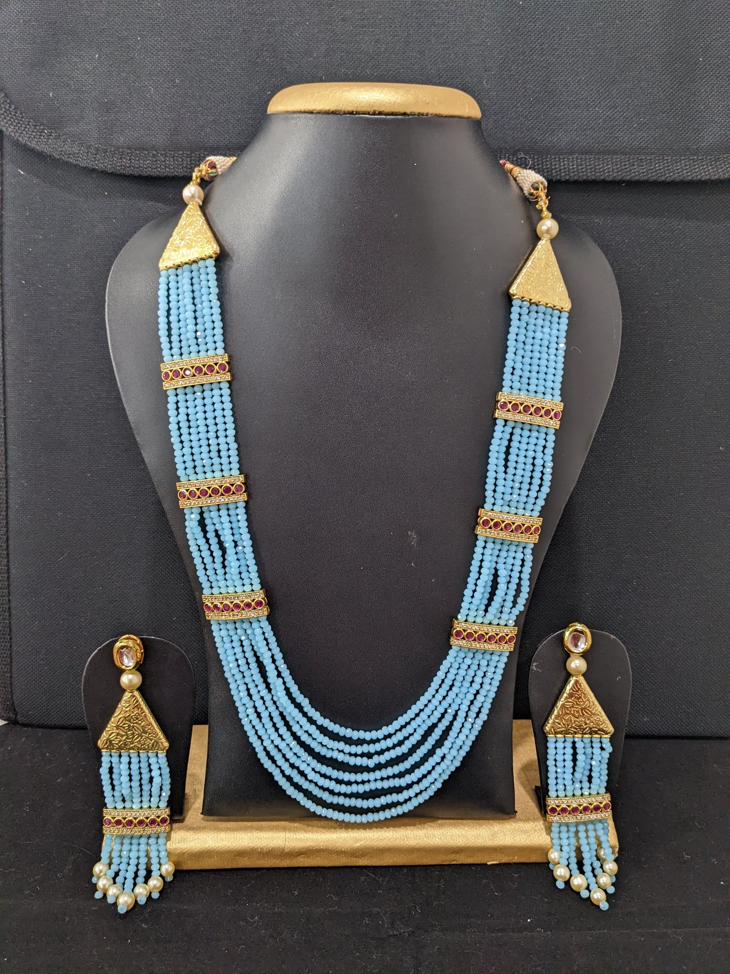 Multi stranded light blue crystal bead long chain necklace and tassel earrings set