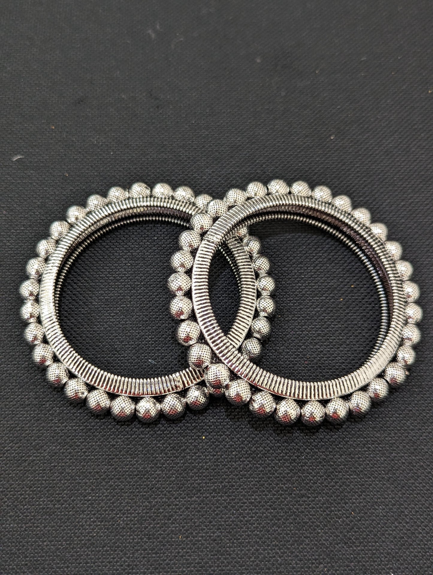Bright silver Ball design pair bangles