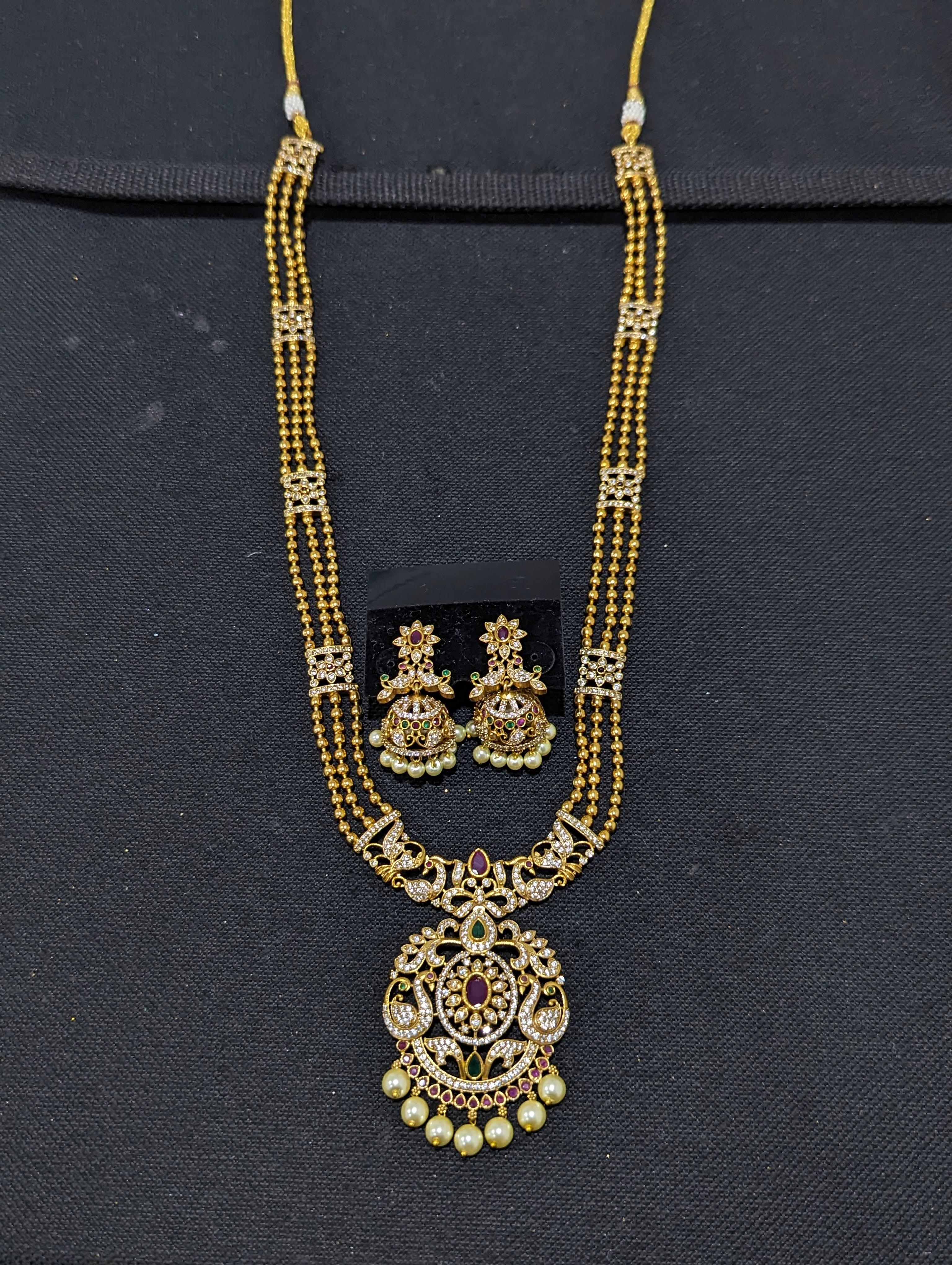 Cz stones peacock design long necklace with matching jumka earrings –  Globus Fashions