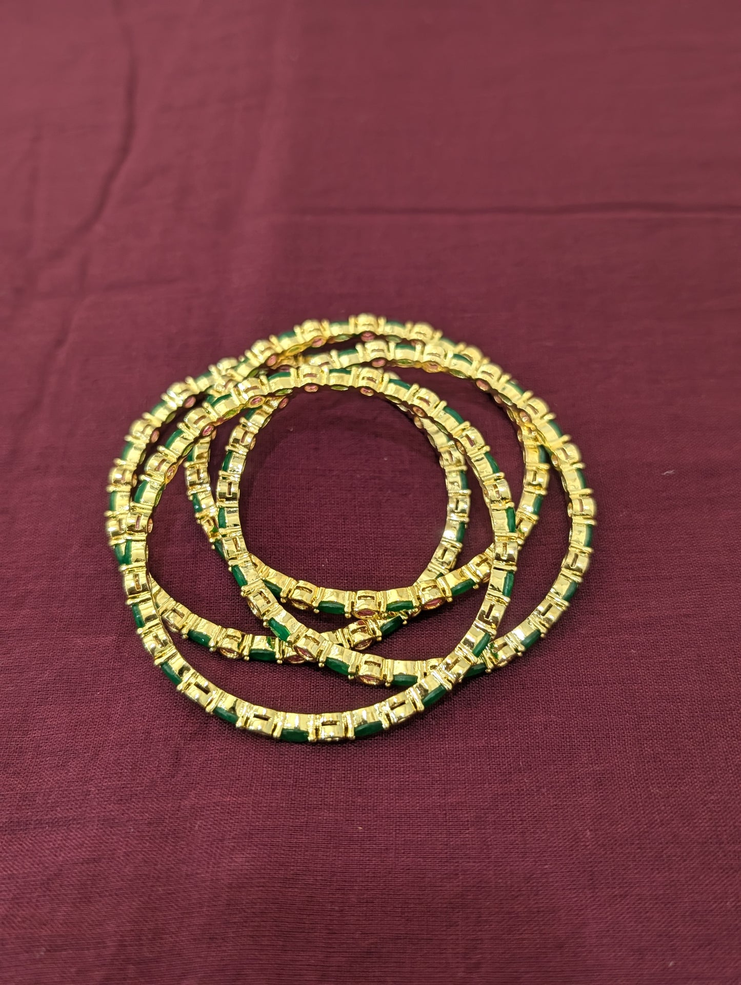 Ruby Green CZ one gram gold polished bangles - Set of 4