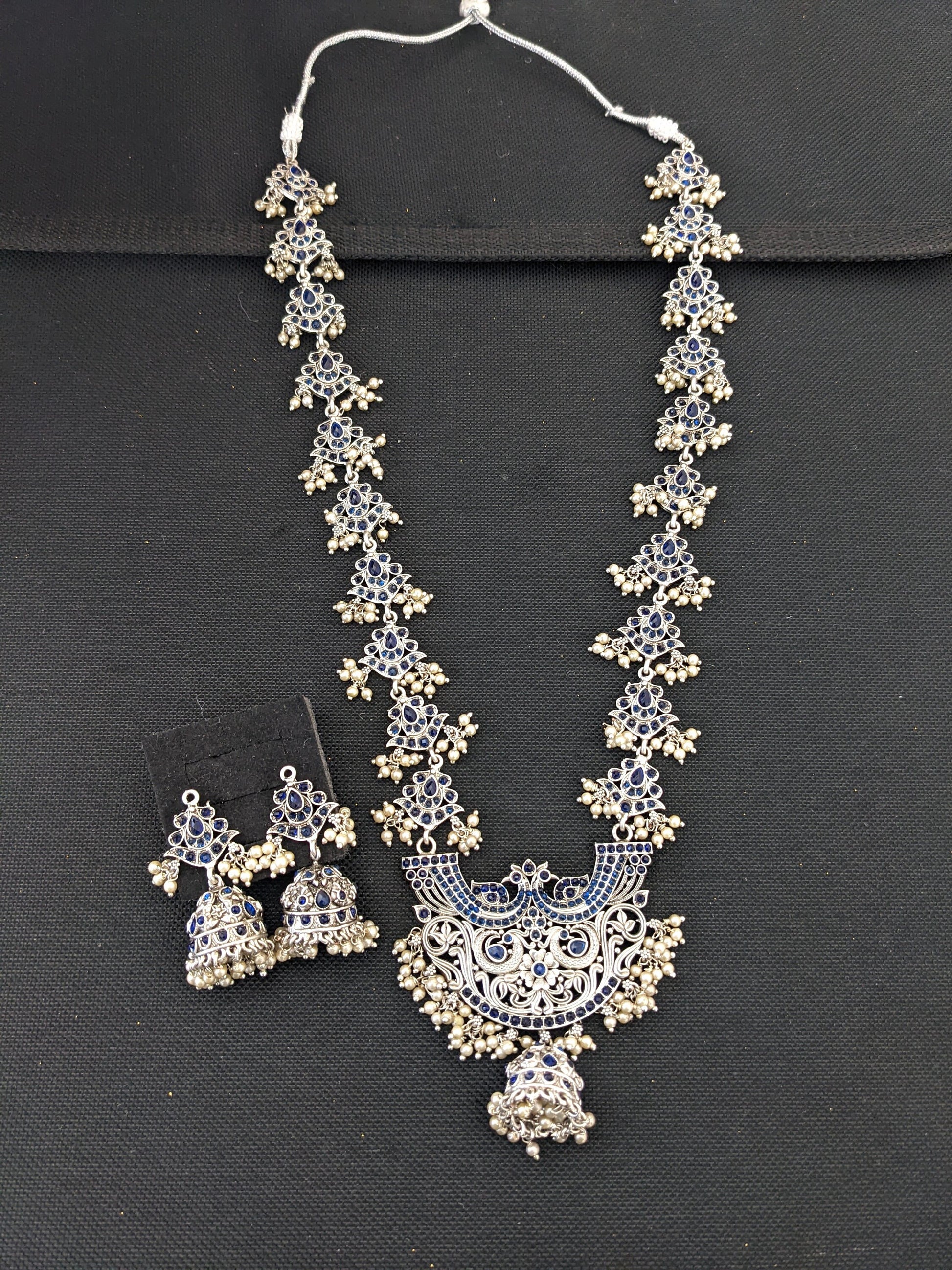 Guttapusalu Silver plated Polki Long necklace and earrings set - Simpliful