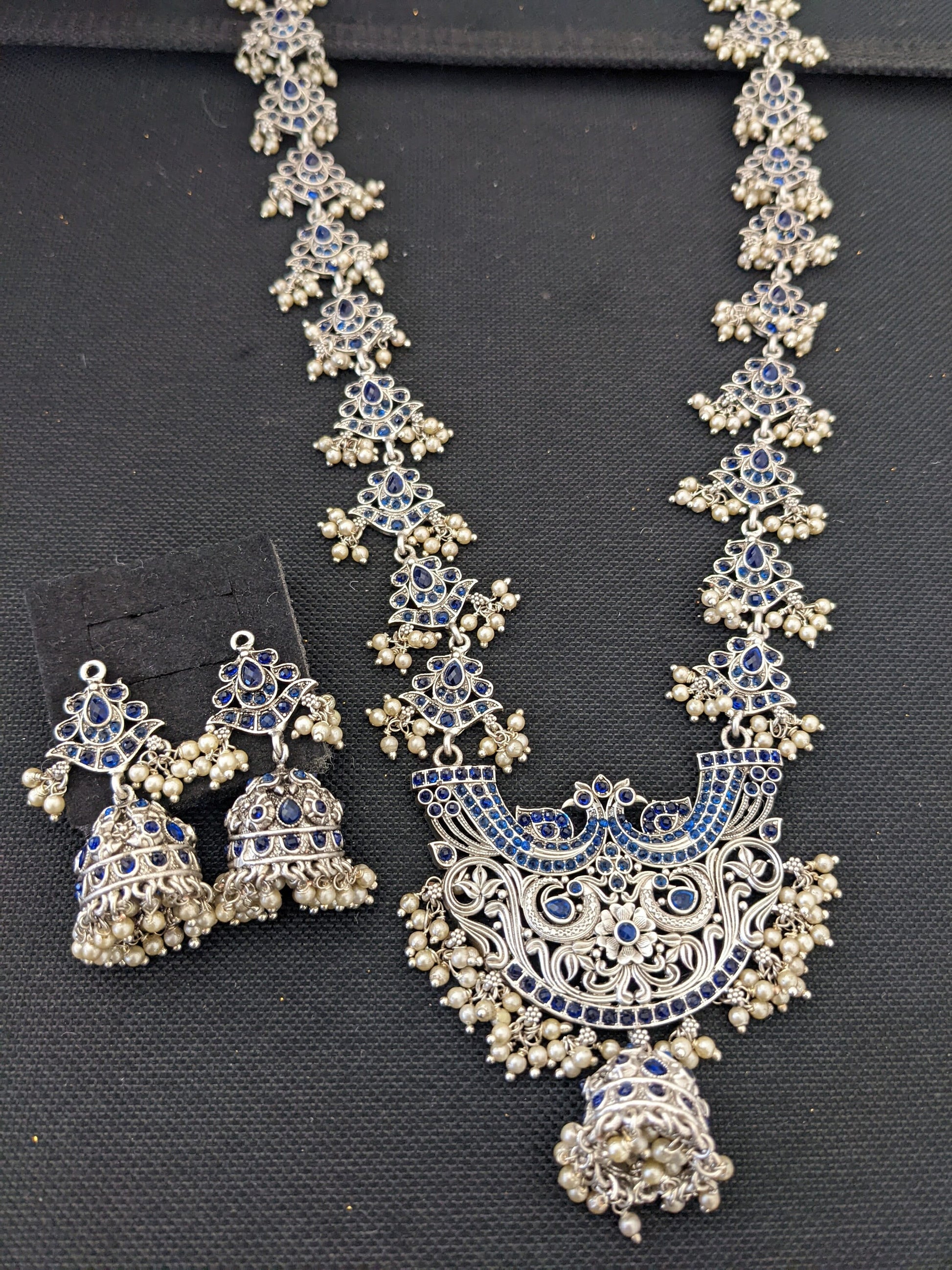 Guttapusalu Silver plated Polki Long necklace and earrings set - Simpliful