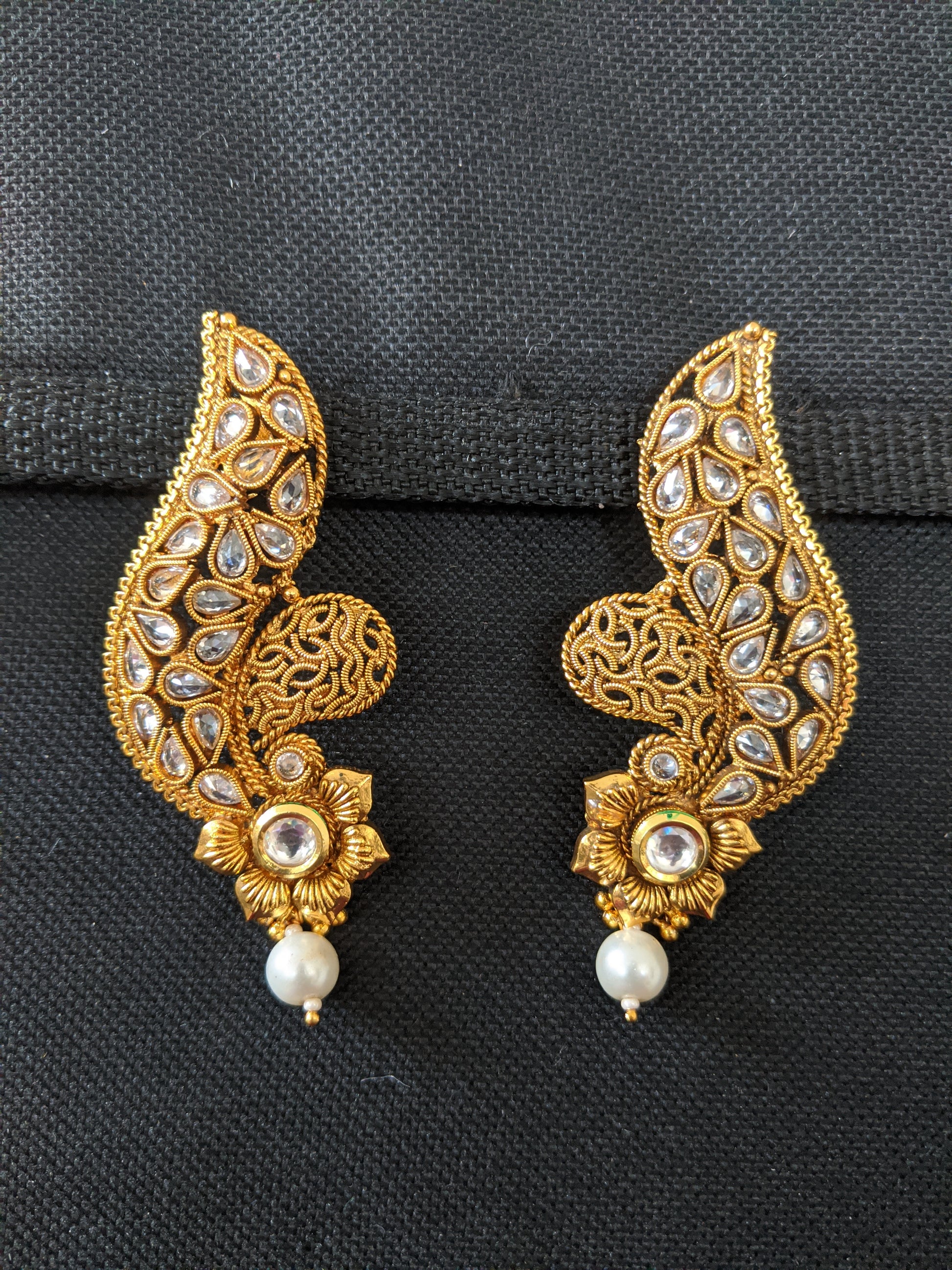 Curvy design polki stone pasted flower long gold imitation earring - Simpliful