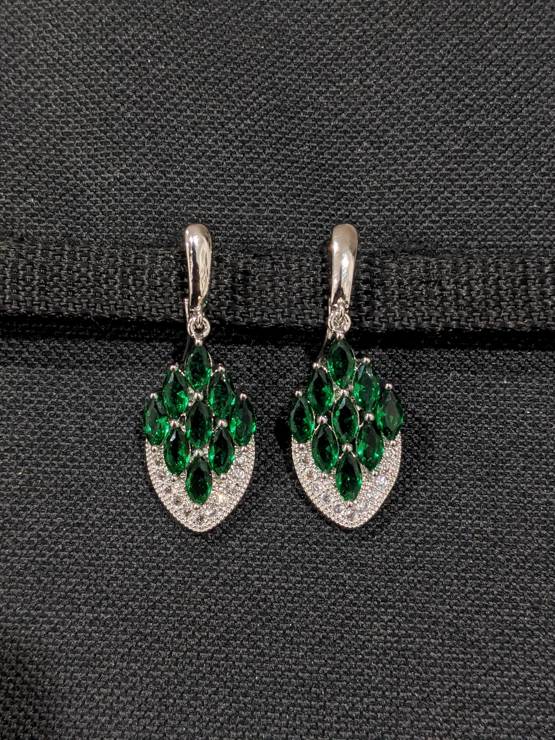Shiny CZ stone embedded platinum finish curved diamond design earrings - Simpliful