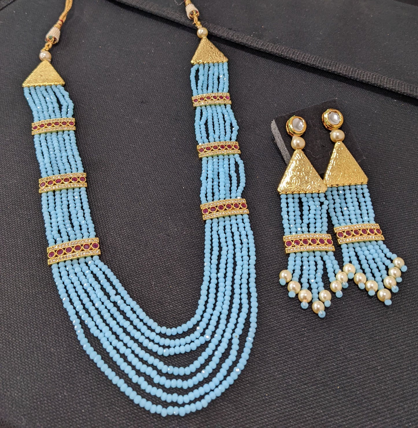 Multi stranded light blue crystal bead long chain necklace and tassel earrings set
