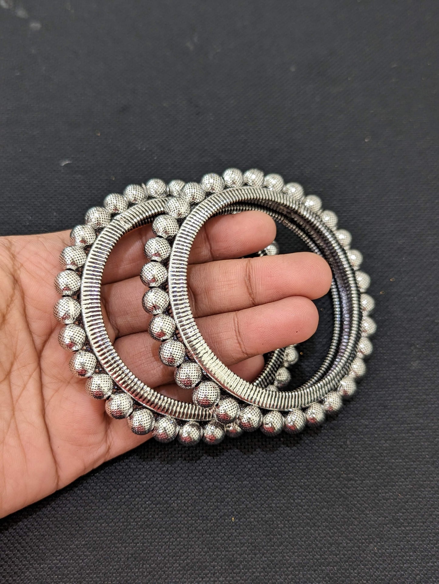 Bright silver Ball design pair bangles