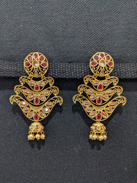Polki stone pasted Gold plated Unique Jhumka Earrings